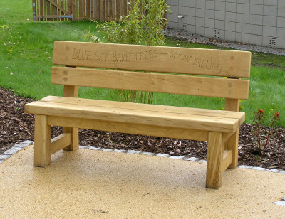Engraved green oak poem bench
